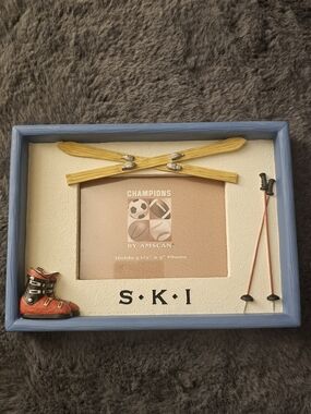 Amscan Blue Frame with Yellow Skis and Red-Orange Boot